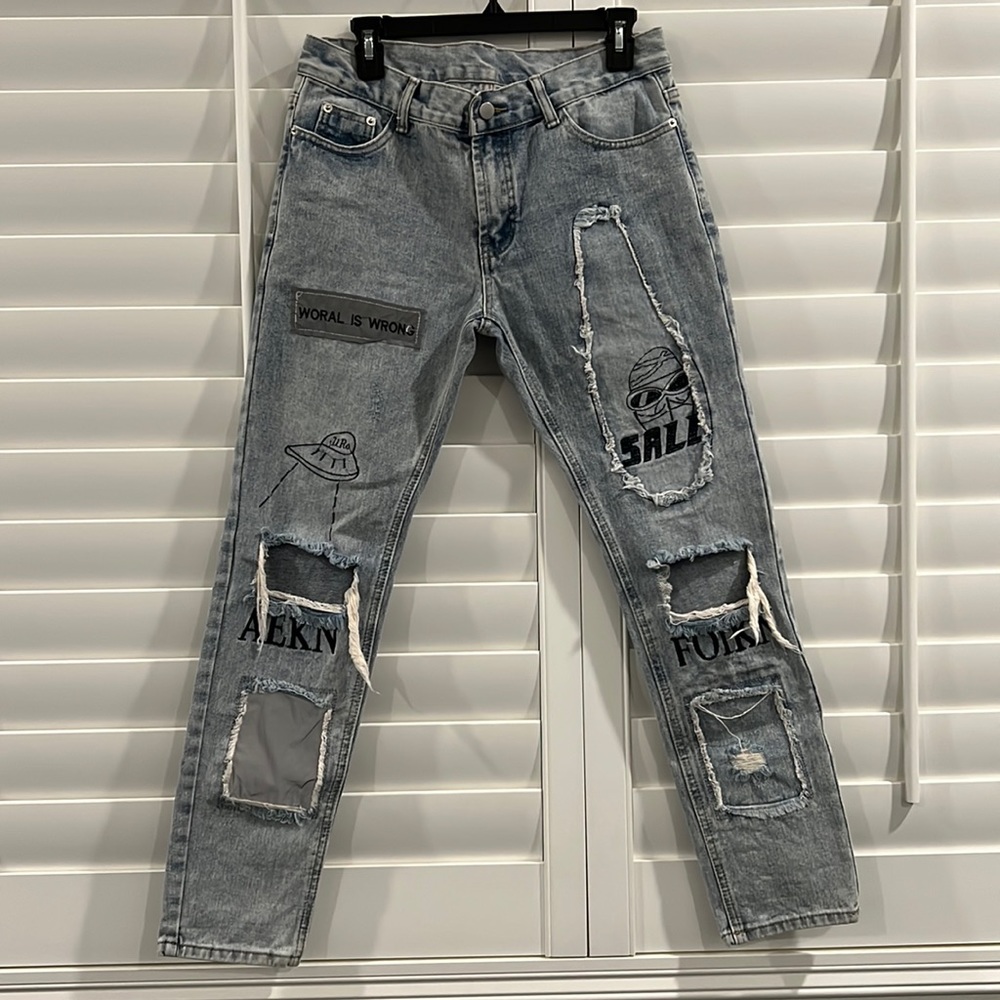 Custom jeans.   Patches, embroidered and rips.
